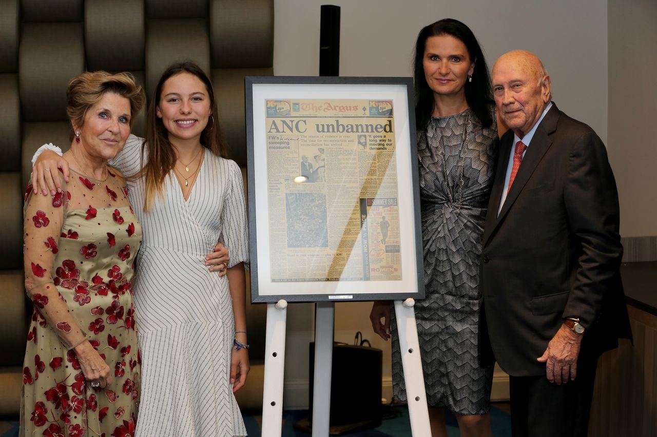 Michaela Bakala and the de Klerks with the replica of the Cape Argus newspaper front page from February 2, 1990.
